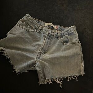 Levi 550 vintage/naturally distressed cut off shorts.